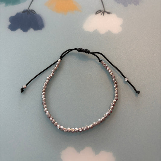 Beaded headband on a floral-patterned surface